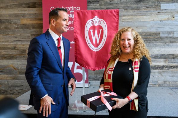 David Kohler, chair and chief executive officer of Kohler Co., presents a gift to Chancellor Jennifer Mnookin